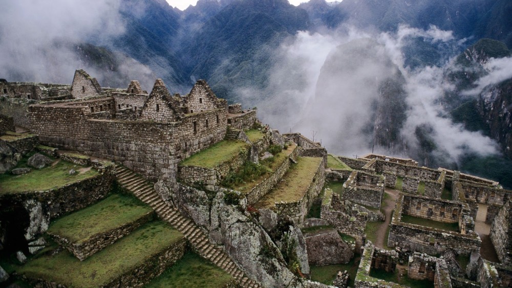 Aerial view of the ancient stone ruins of Machu Picchu nestled in the Andes mountains, Peru